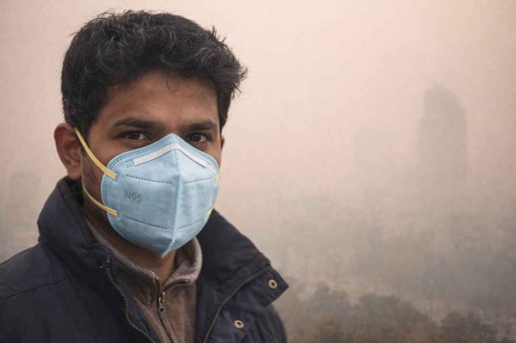 Person wearing N95 mask to protect from high AQI air pollution in India